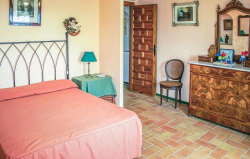 A bed or beds in a room at CASA RURAL LA FLORIDA, MORÓN de la FRONTERA