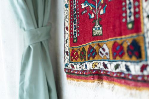 a close up of a red dress with a curtain at Atilla's Cave Hotel in Nevsehir