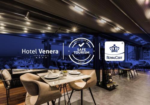 a restaurant with a table and chairs in a room at Hotel Venera Istanbul Old City in Istanbul