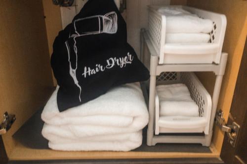 a bunch of towels in a bathroom closet at Beach Escape - Top floor Ocean views - Heated pool - Seawall Blvd in Galveston