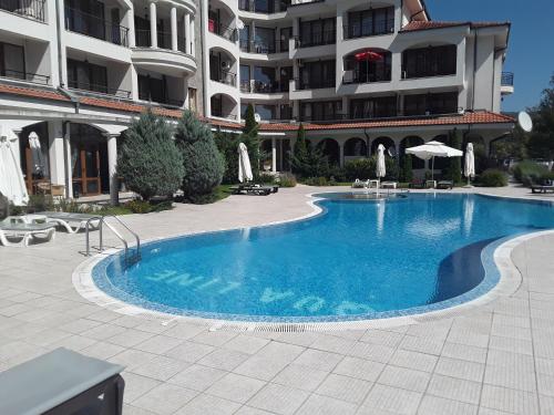 a large swimming pool in front of a building at CHATEAU DEL MAR C31a Studio Sunny Beach in Sunny Beach