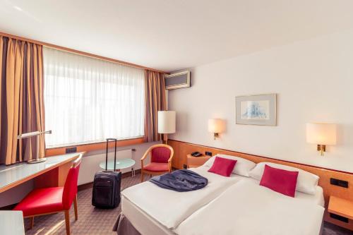Ένα ή περισσότερα κρεβάτια σε δωμάτιο στο Mercure Hotel Köln City Friesenstraße
