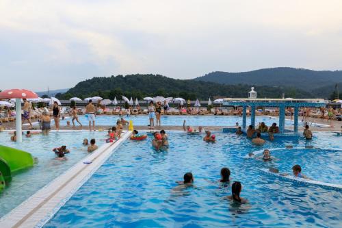 a large group of people in a swimming pool at Hotel Terme Ozren in Bosansko Petrovo Selo