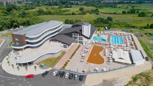 an aerial view of a large building with a pool at Hotel Terme Ozren in Bosansko Petrovo Selo