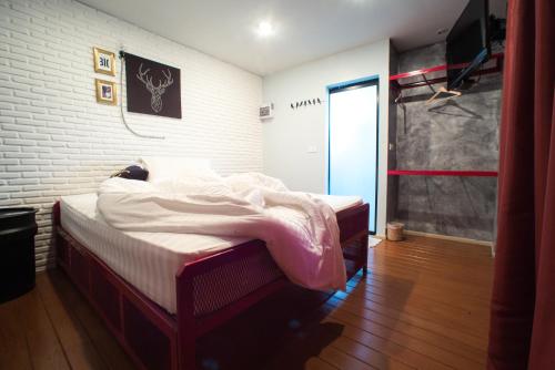 Postel nebo postele na pokoji v ubytování Patoey House