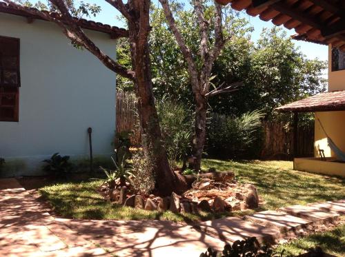 a tree in the middle of a yard at Pousada Por do Sol in Sao Jorge