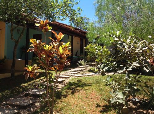a garden in front of a house at Pousada Por do Sol in Sao Jorge