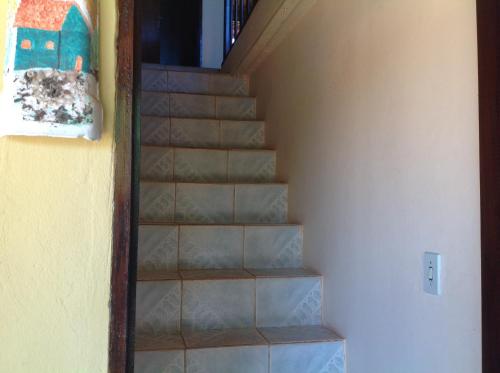 a set of stairs leading up to a house at Pousada Por do Sol in Sao Jorge