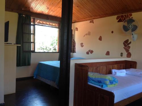 Ένα ή περισσότερα κρεβάτια σε δωμάτιο στο Pousada Por do Sol