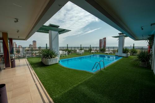 a swimming pool on the roof of a building at Hotel Cecilia in Asuncion