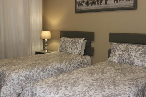 Postel nebo postele na pokoji v ubytování khaya4u Guesthouse