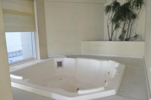 Et badeværelse på Apartamento Pé na Areia 212 - Apartamento Beira Mar 210 - Cabo Frio