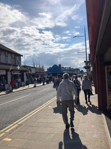 a group of people walking down a street at Mablethorpe Static Holiday Home in Mablethorpe