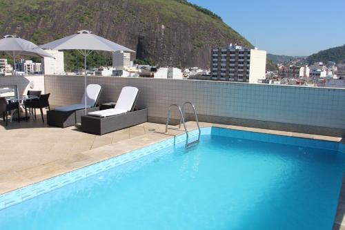 a swimming pool on the roof of a building at Riale Vilamar Copacabana in Rio de Janeiro