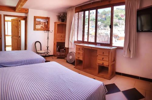 Una cama o camas en una habitación de Meson de Juan Valle