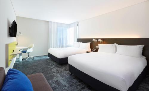 Voodi või voodid majutusasutuse Holiday Inn Express Sydney Macquarie Park by IHG toas