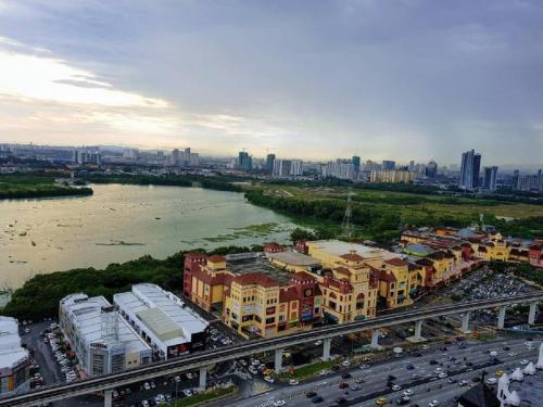 an aerial view of a city with a river and buildings at Skypod Residence Puchong in Puchong