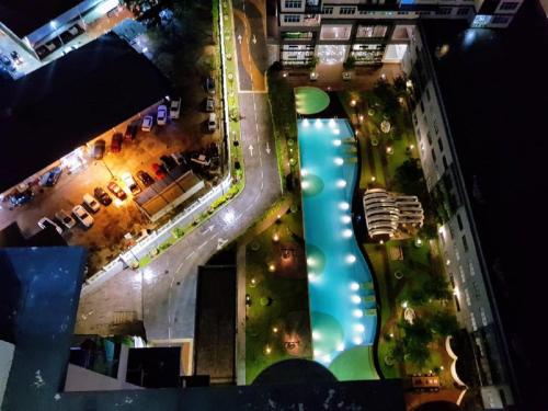an overhead view of a pool in a city at night at Skypod Residence Puchong in Puchong
