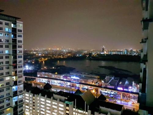a view of a city at night from a building at Skypod Residence Puchong in Puchong