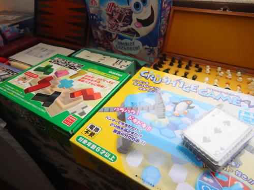 a table topped with a lego game and some boxes at Star Hotel Akakura in Myoko