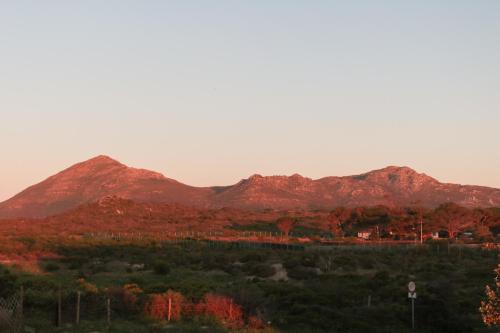 a view of some mountains in the distance at The House of Braganza in Kommetjie