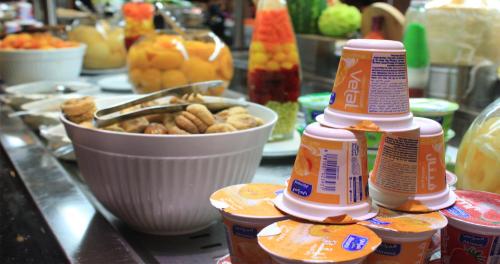 a counter with some peanuts and a bowl of food at Crowne Plaza Madinah by IHG in Al Madinah