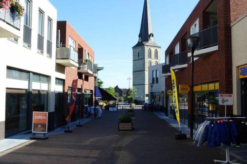 an empty city street with a church in the background at Authentic Stays - 6p-maisonette in Eijsden