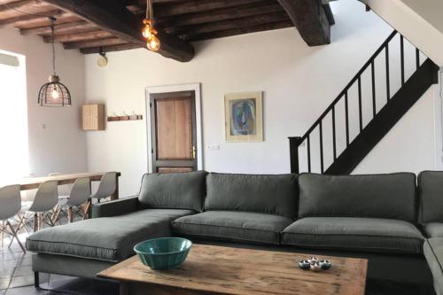 a living room with a couch and a table at Authentic Stays - 6p-maisonette in Eijsden