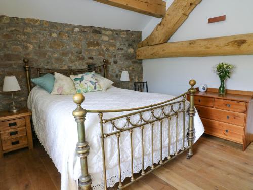 En eller flere senge i et værelse på Foxstones Cottage