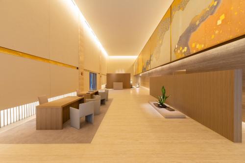 an office with a long corridor with tables and benches at The Okura Heritage Tokyo in Tokyo