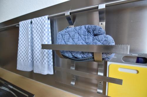a bed on a metal rack in a kitchen at Work and Stay Apartment Cologne- Fühlinger See in Chorweiler