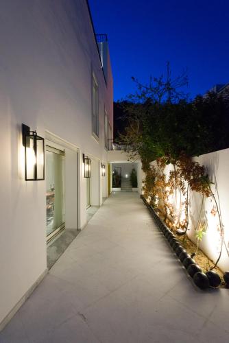 a hallway of a house at night with lights at Maison Dedine- SmallLuxuryHotels -Adults Only in Sidi Bou Saïd