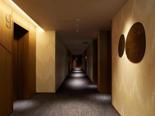 an empty hallway with a long corridor at THE KNOT SAPPORO in Sapporo