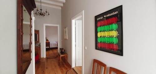 a room with a painting of wine bottles on the wall at Muziqa Apartments in Dubrovnik