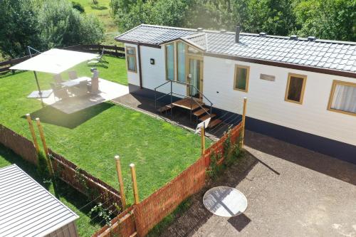 an aerial view of a tiny house in a yard at Ferienhaus Chilllout Chalets Daun-Kradenbach in Kradenbach