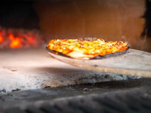 a small pizza sitting on top of a table at Ennerla Hof in Pottenstein