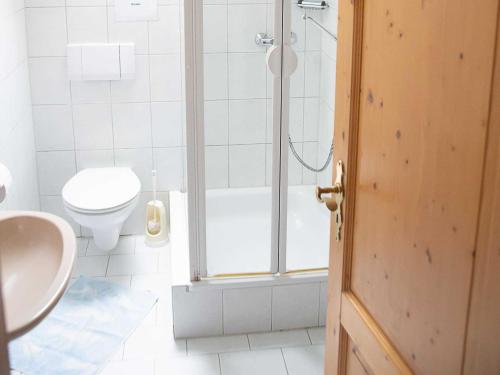 a bathroom with a shower and a toilet and a sink at Ennerla Hof in Pottenstein