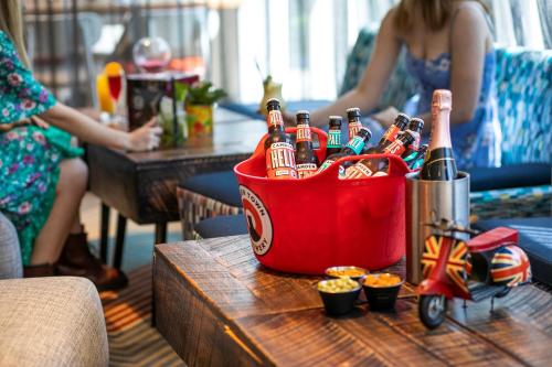 a bucket of beer bottles on a table at Holiday Inn London Camden Lock by IHG in London