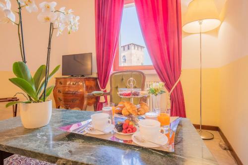 a tray of food on a table in a room at Corte Realdi Verona in Verona