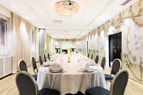 a conference room with a long table and chairs at Elite Park Avenue Hotel in Gothenburg