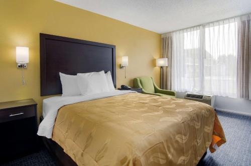 a hotel room with a large bed and a window at Quality Inn Verona - Staunton North in Staunton