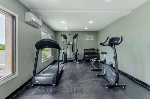 a gym with several tread machines in a room at Quality Inn Verona - Staunton North in Staunton