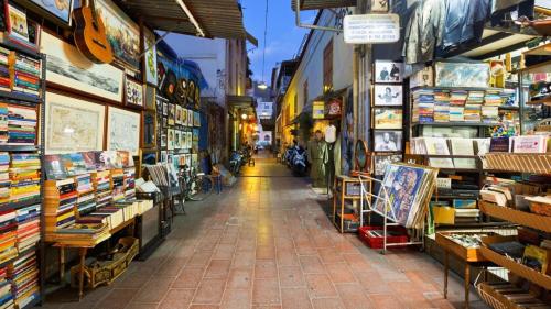 an aisle of a store filled with lots of items at Theasis Athens in Athens