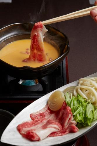 a plate of food with a piece of meat and noodles at ANDO HOTEL NARA Wakakusayama -DLIGHT LIFE & HOTELS- in Nara