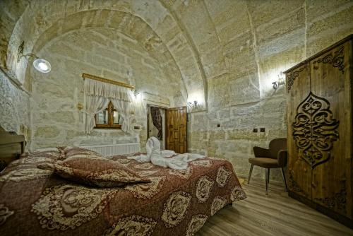 Ένα ή περισσότερα κρεβάτια σε δωμάτιο στο Cappadocia Fairy Tale Suites