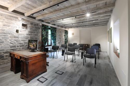 a room with a group of chairs and a table at Suites&Atelier Lake Como in Como