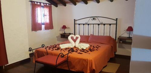 Tempat tidur dalam kamar di Cortijo El Pajar