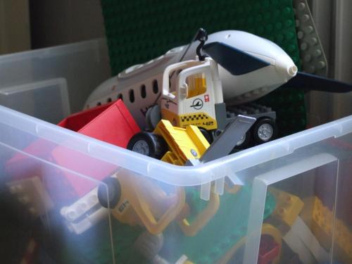 a plastic drawer with a toy truck and an airplane at Skålleruds Gård in Åsensbruk