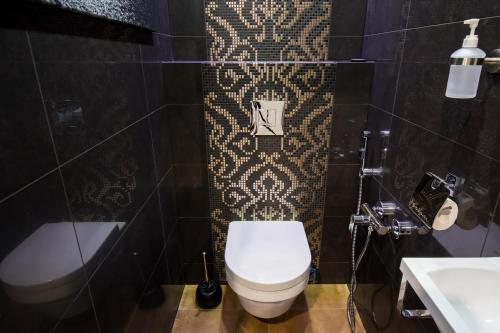 Koupelna v ubytování LuxeCityApartment