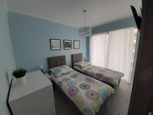 Ένα ή περισσότερα κρεβάτια σε δωμάτιο στο Apartament Aniutka